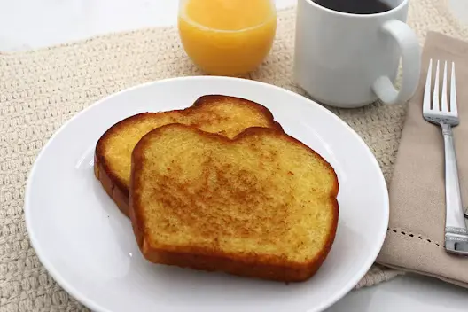 Toast (200 calories), featuring slices of toasted bread served warm as a classic breakfast side.
