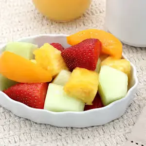 Fresh Fruit Bowl (100 calories), featuring a colorful assortment of fresh, seasonal fruit served in a bowl.
